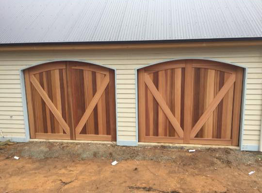 Curved-top-cedar-counterweight-Garage-Door
